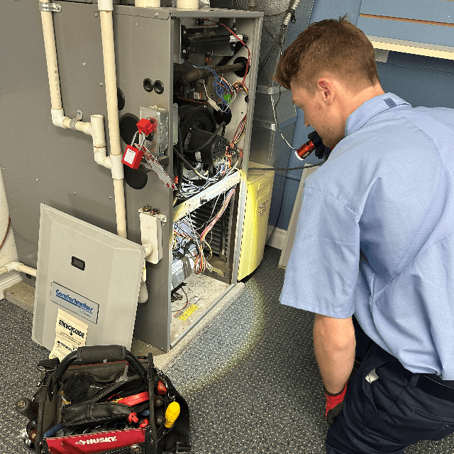 Man working on HVAC unit