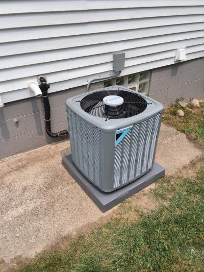 New Daikin central air conditioner outside a home in Whitmore Lake, Michigan